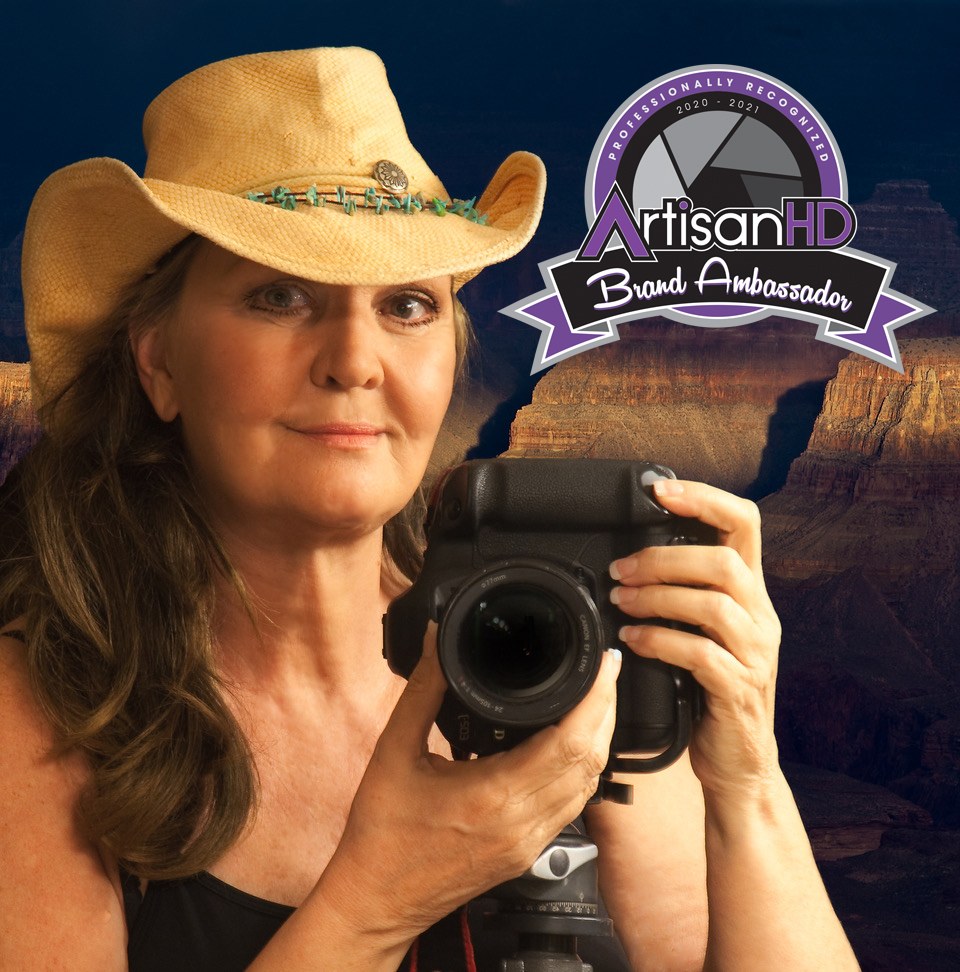Suzanne Mathia self photo with Brand ambassador badge Suzanne Mathia self photo with Brand ambassador badge holding camera and wearing a cowgirl hat